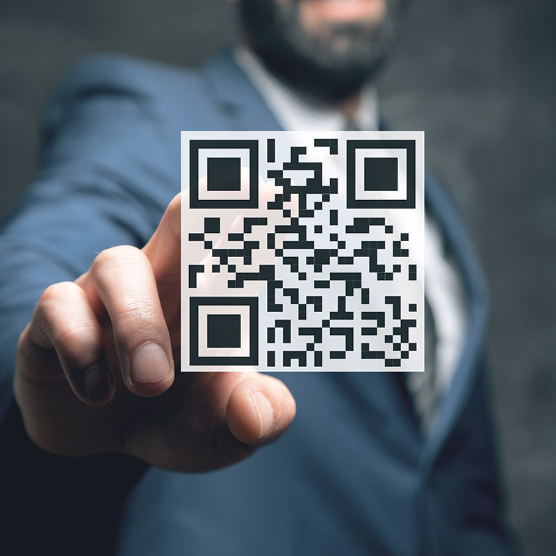 Man Tapping QR Code